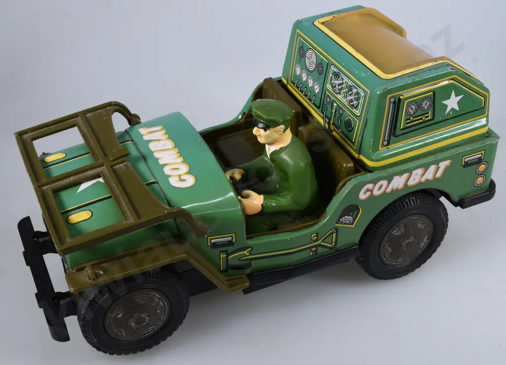 TIN PLATED BATTERY OPERATED COMBAT JEEP Image 1++