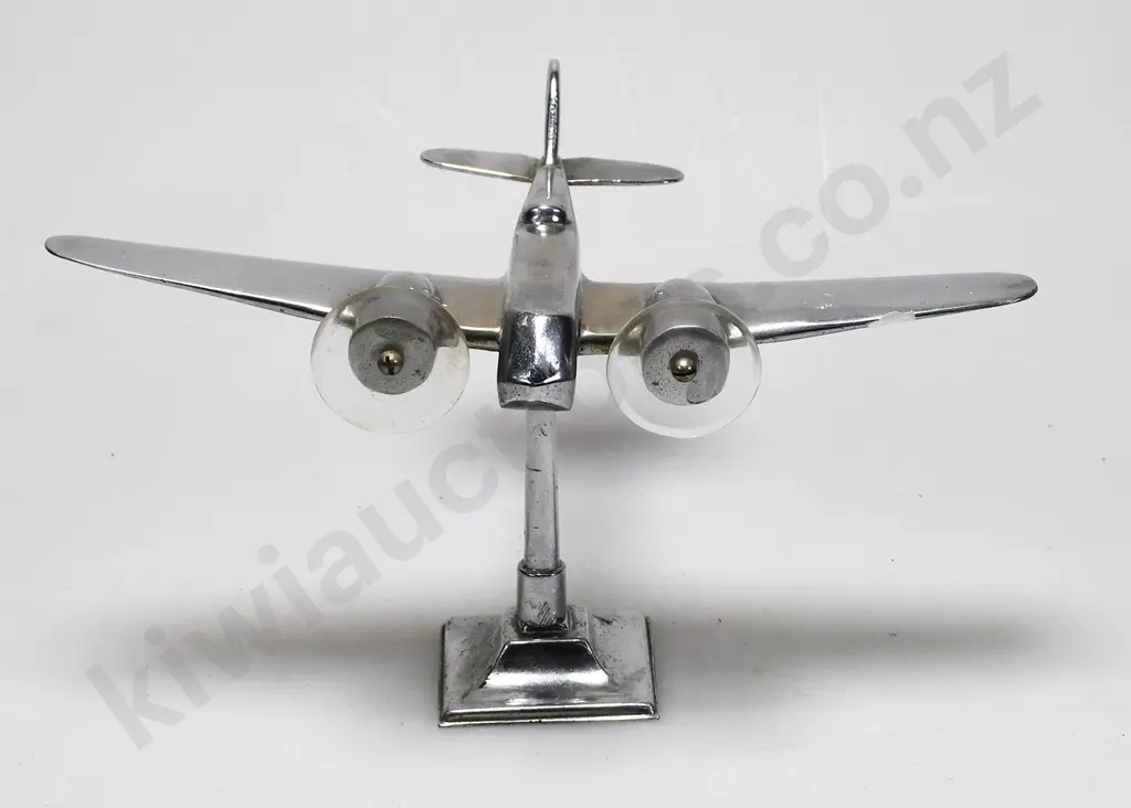 CHROME PLATED MODEL AIRPLANE ON STAND Image 1++