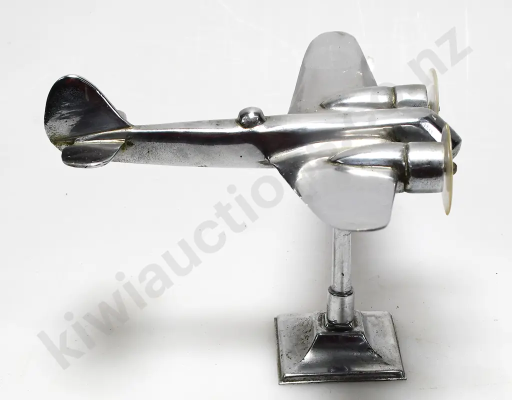 CHROME PLATED MODEL AIRPLANE ON STAND Image 1++