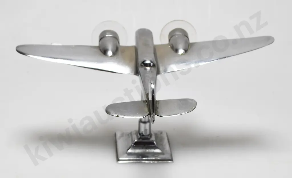 CHROME PLATED MODEL AIRPLANE ON STAND Image 1++