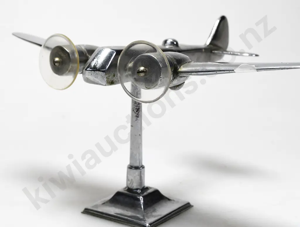 CHROME PLATED MODEL AIRPLANE ON STAND Image 1++