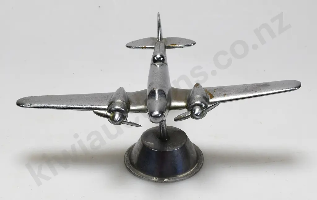 CHROME PLATED MODEL AIRPLANE ON STAND Image 1++