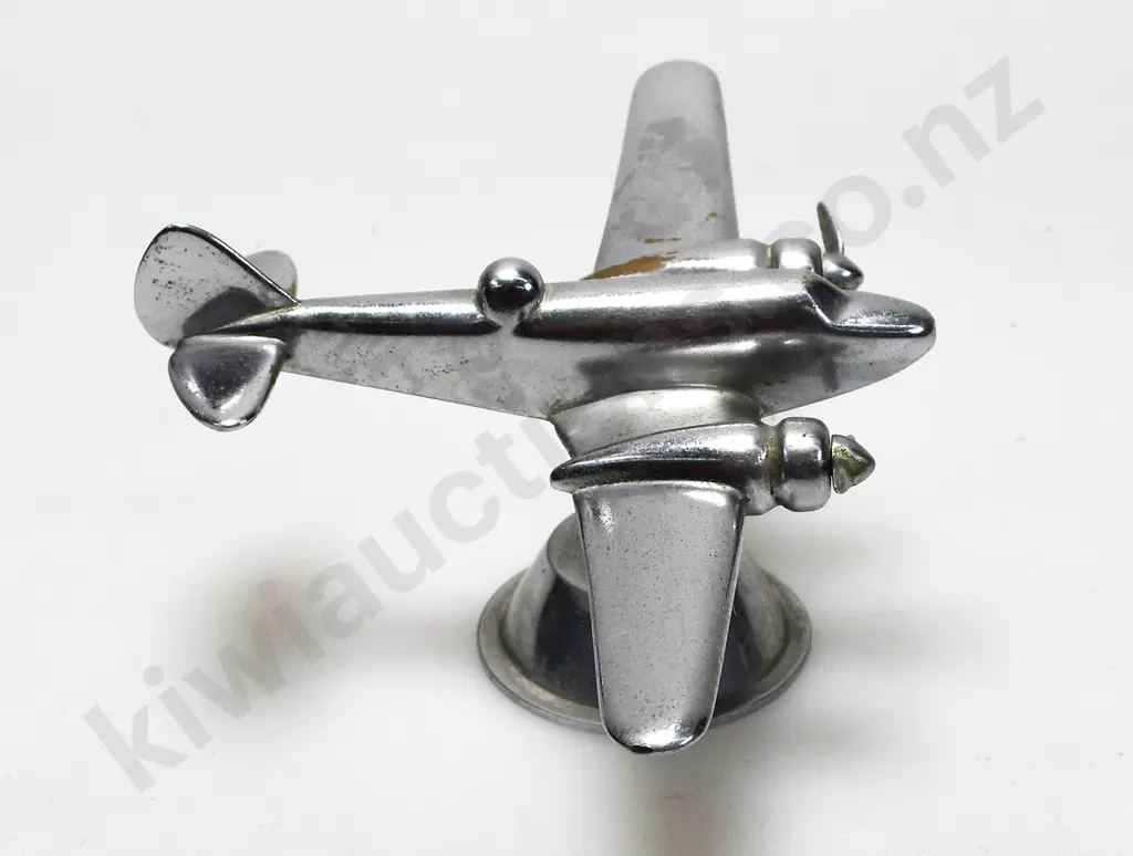 CHROME PLATED MODEL AIRPLANE ON STAND Image 1++
