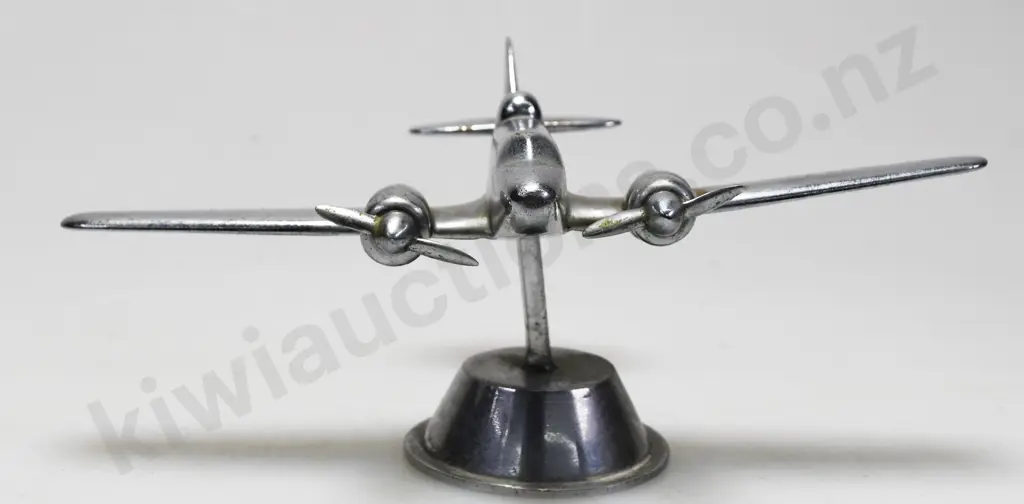 CHROME PLATED MODEL AIRPLANE ON STAND Image 1++