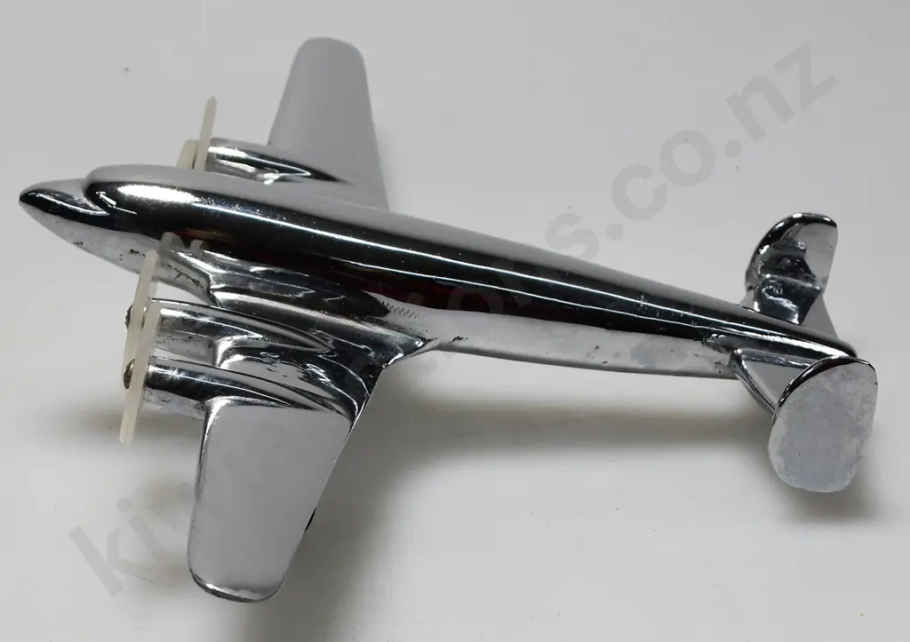 CHROME PLATED MODEL AIRPLANE ON STAND Image 1++