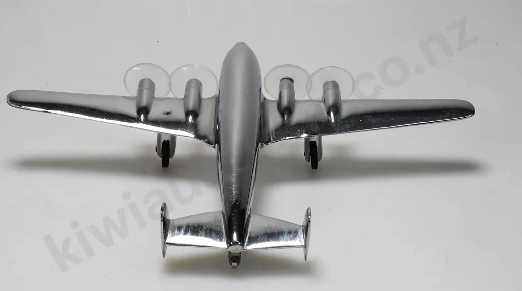 CHROME PLATED MODEL AIRPLANE ON STAND Image 1++
