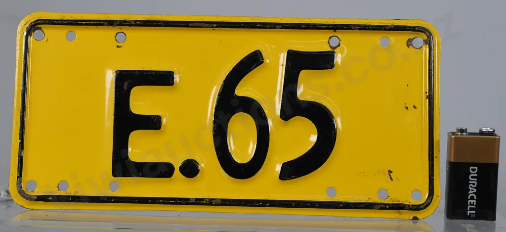 NZ EXEMPT MOTORCYCLE NUMBER PLATE, E-65, 1961-1965 Image 1++