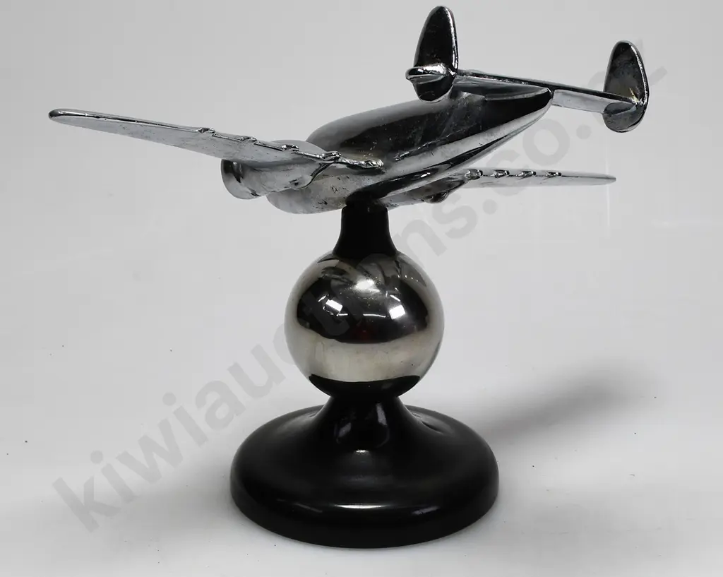 CHROME PLATED MODEL AIRPLANE ON STAND Image 1++
