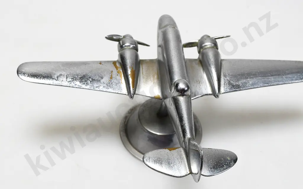 CHROME PLATED MODEL AIRPLANE ON STAND Image 1++