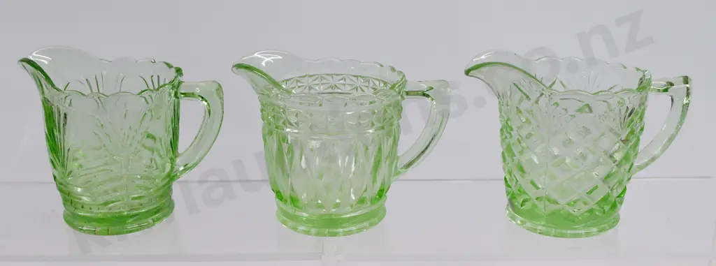 DEPRESSION GLASS JUGS IN GREEN. Image 1++