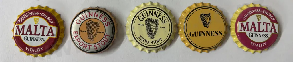 GUINNESS BOTTLE CAPS 25 DIFFERENT Image 1++