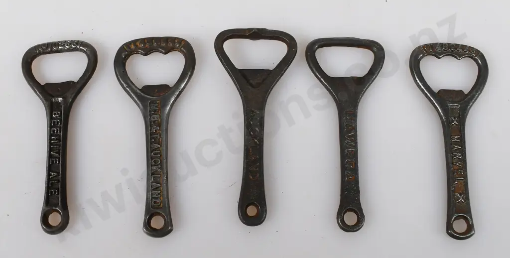 ASSORTED CAST IRON BOTTLE OPENERS Image 1++
