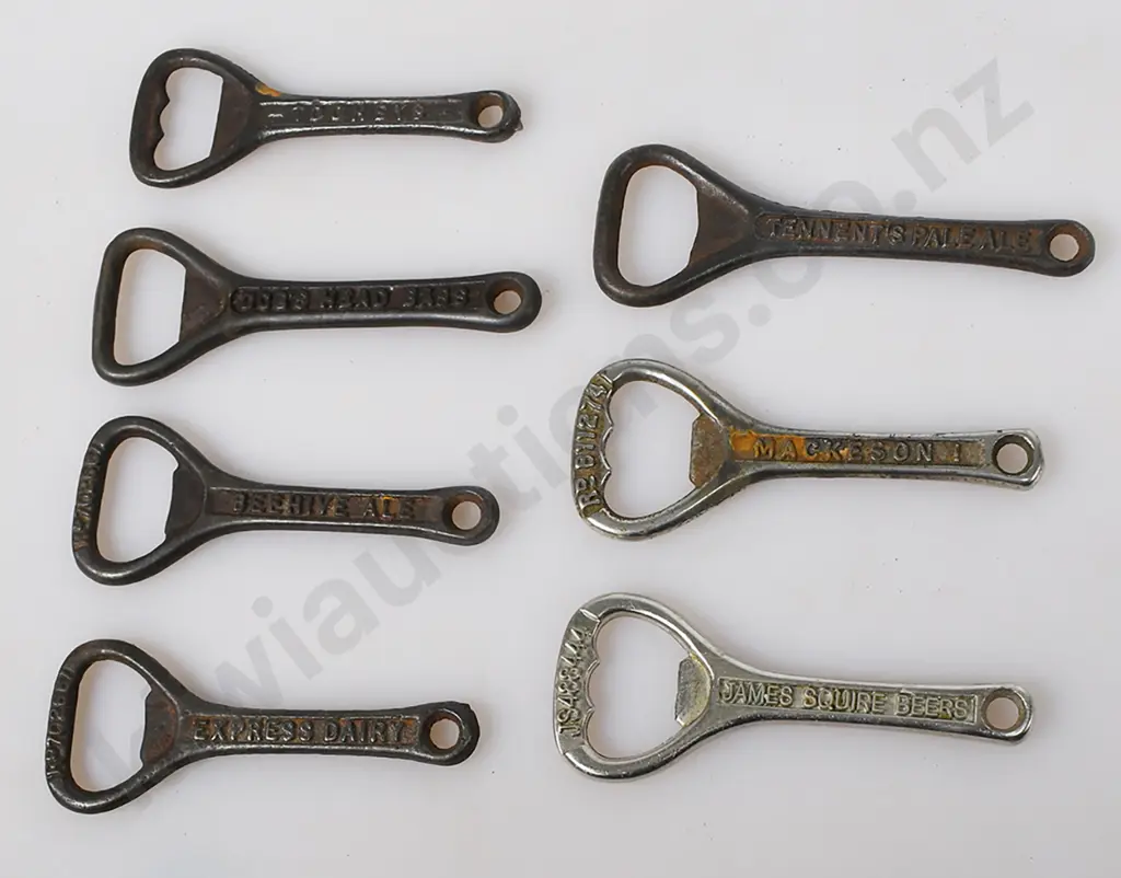 ASSORTED CAST IRON BOTTLE OPENERS Image 1++