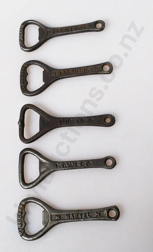 ASSORTED CAST IRON BOTTLE OPENERS Image 1++