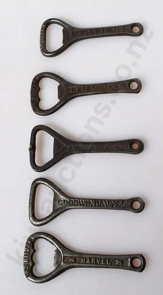 ASSORTED CAST IRON BOTTLE OPENERS Image 1++