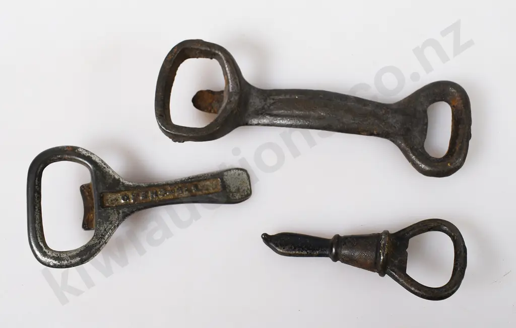 ASSORTED CAST IRON BOTTLE OPENERS Image 1++