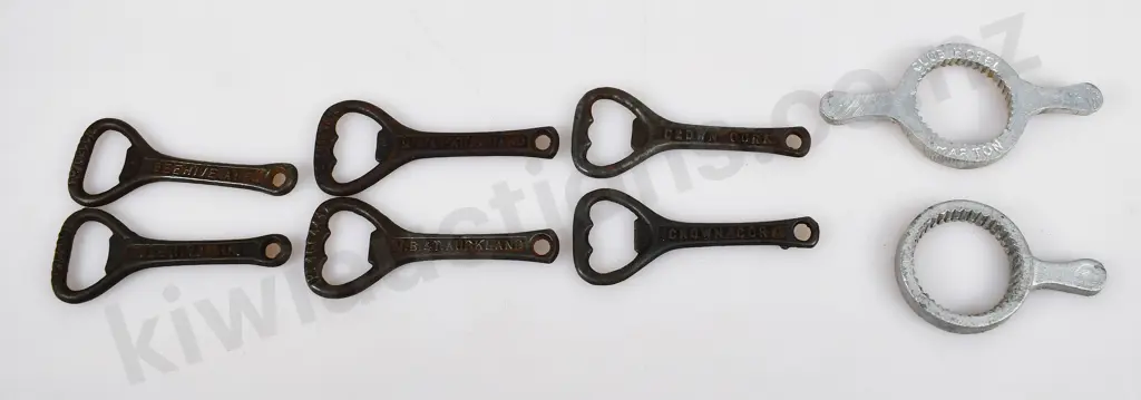 ASSORTED CAST IRON BOTTLE OPENERS Image 1++