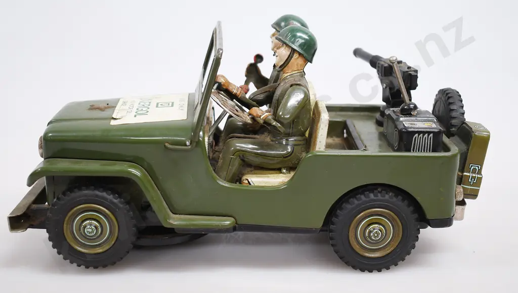 TIN PLATED BATTERY OPERATED ARMY JEEP Image 1++