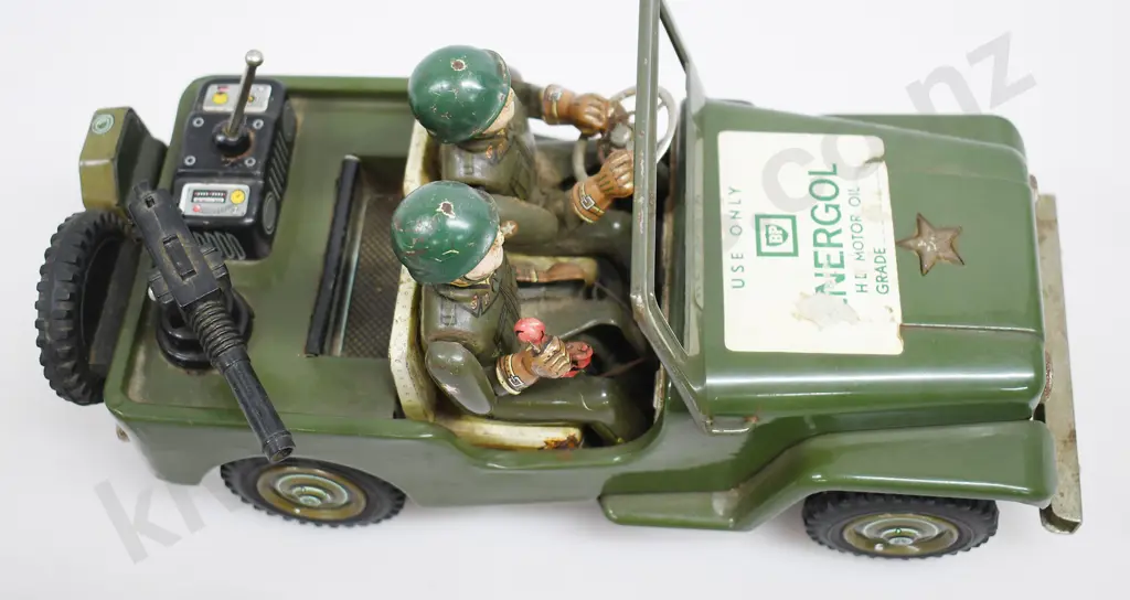 TIN PLATED BATTERY OPERATED ARMY JEEP Image 1++