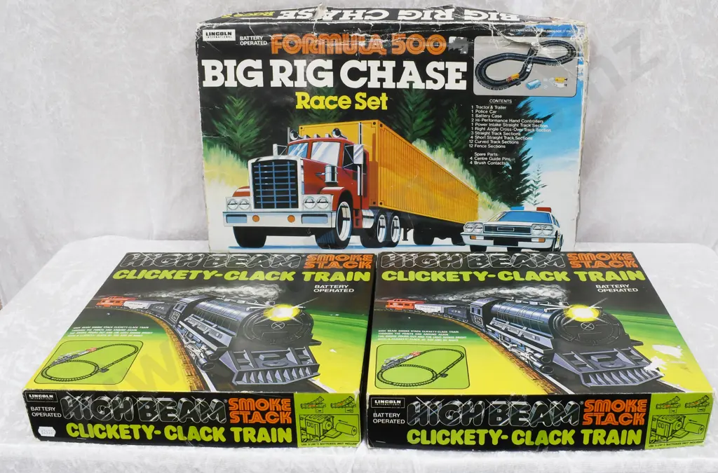 BOXED LINCOLN INTERNATIONAL TOYS, CLICKETY-CLACK TRAIN, BIG RIG CHASE Image 1++